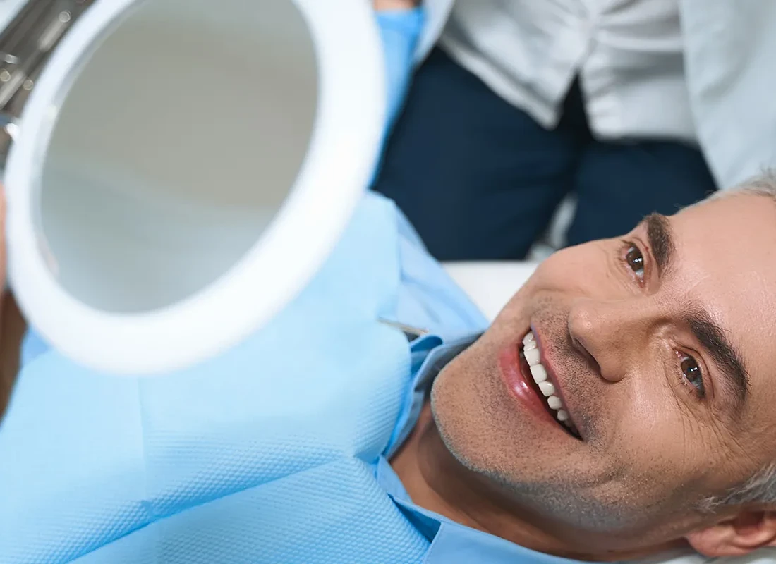 patient-male-smile-mirror.webp
